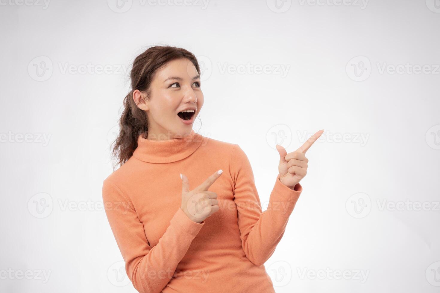 Asian beautiful woman exited surprise face expression . female feels shocked. exciting smile and happy adorable rejoices. Very enjoy and fun relax time. wow, girl holding smartphone. Smile. photo