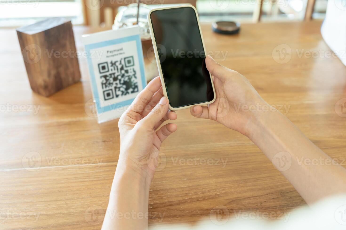 Woman use smartphone to scan QR code to pay in cafe restaurant with a digital payment without cash. Choose menu and order accumulate discount. E wallet, technology, pay online, credit card, bank app. photo