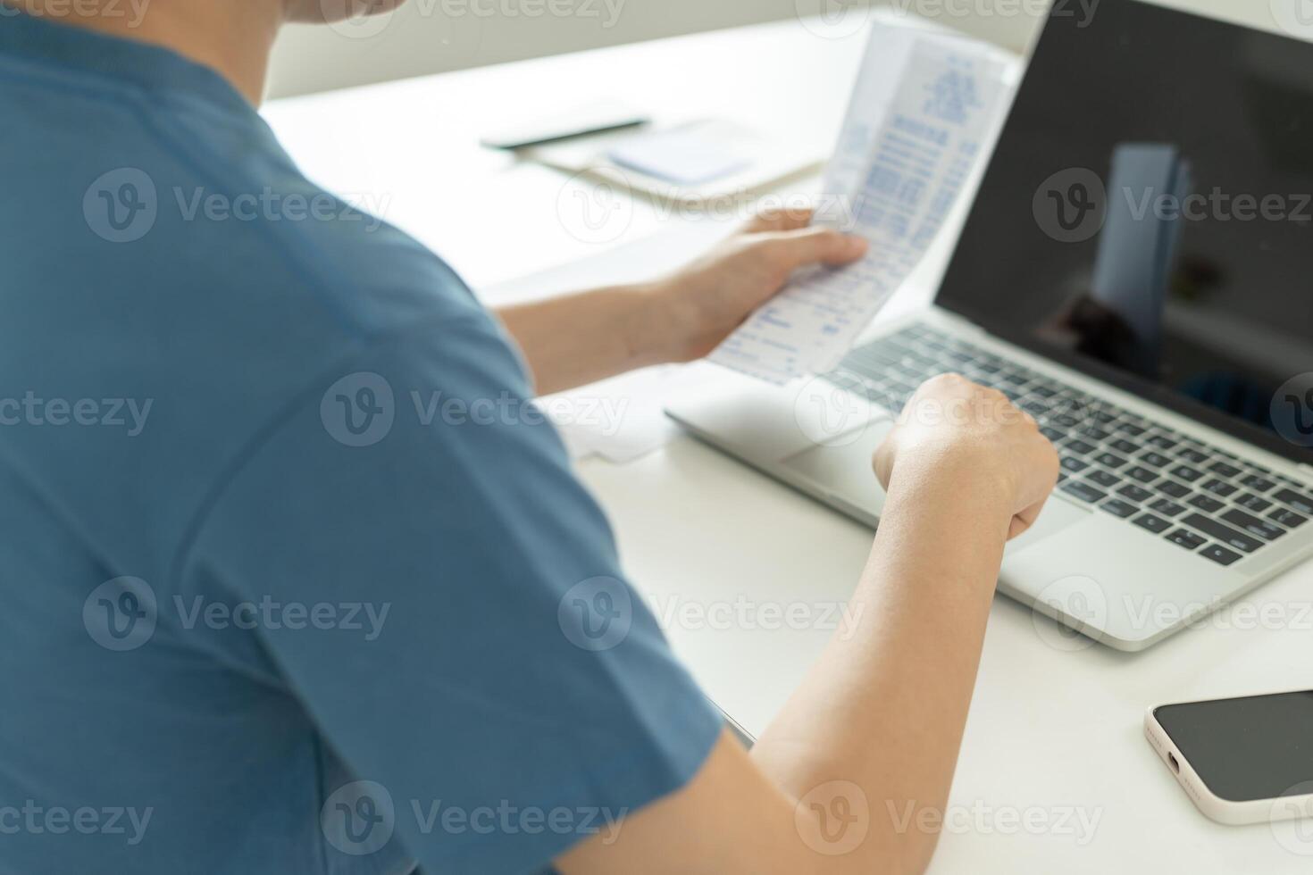 Stressed and headache woman with large bills or invoices no money to pay to expenses and credit card debt. shortage, Financial problem, bankruptcy, mortgage, loan, bankrupt, poor, empty wallet photo