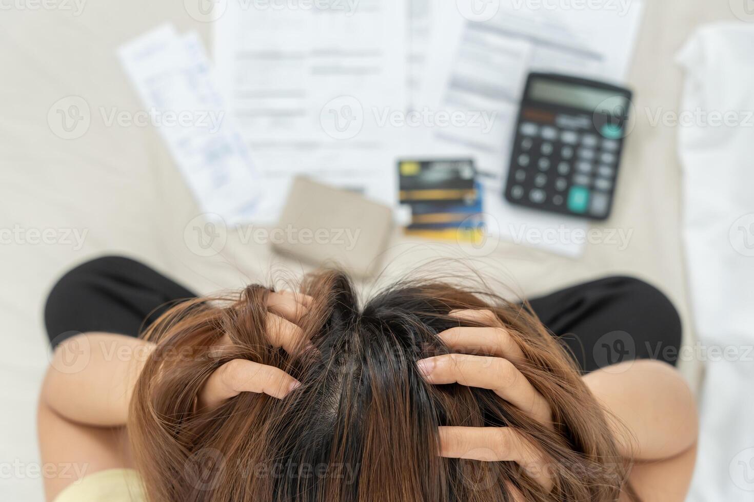 Stressed and headache woman with large bills or invoices no money to pay to expenses and credit card debt. shortage, Financial problem, bankruptcy, mortgage, loan, bankrupt, poor, empty wallet photo