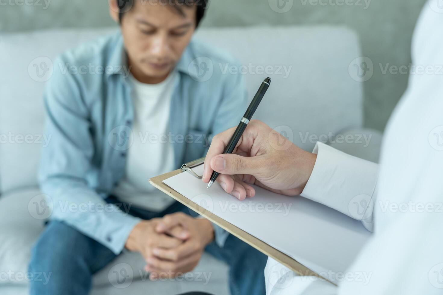 man with mental health problems is consulting. psychiatrist is recording the patient's condition for treatment. encouragement, love and family problem, bipolar , depression patient, protect suicide photo