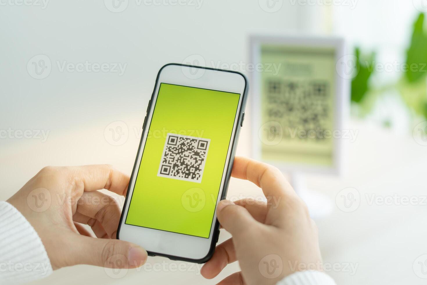 Woman use smartphone to scan QR code for order menu in cafe restaurant with a digital delivery. Choose menu and order accumulate discount. E wallet, technology, pay online, credit card, bank app photo