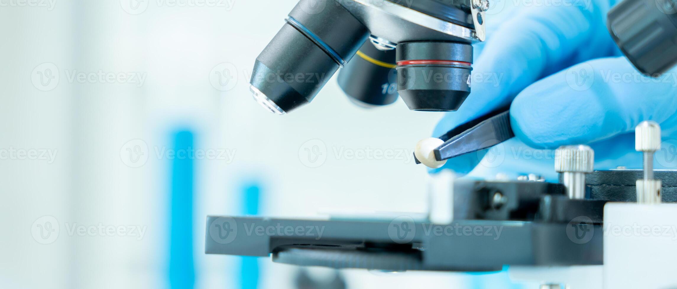 Scientist analyze biochemical samples in advanced scientific laboratory. Medical professional use microscope look microbiological developmental of viral. Biotechnology research in science lab. photo