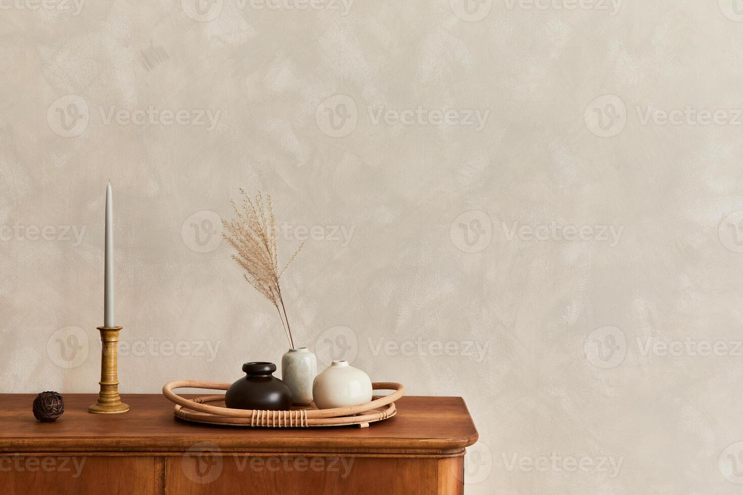 Minimalist composition of living room with commode, table lamp, dried flower in vase, book, decoration and elegant personal accessories in stylish home decor. Template. Copy space. photo