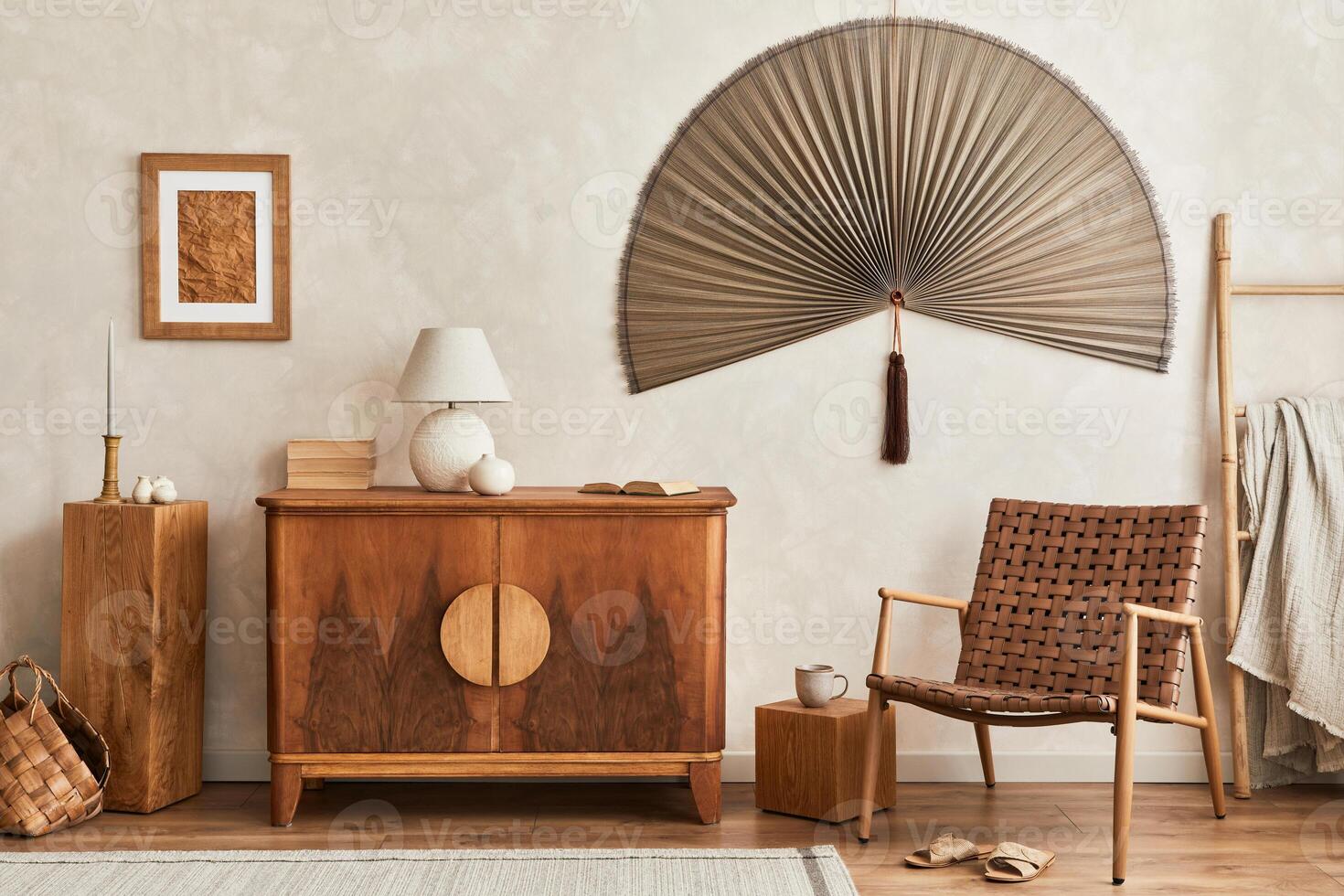 Interior design of neutral living room with retro commode, mock up poster frame, cube, table lamp, decoration and elegant personal accessories in home decor. Template. Japandi concept. photo