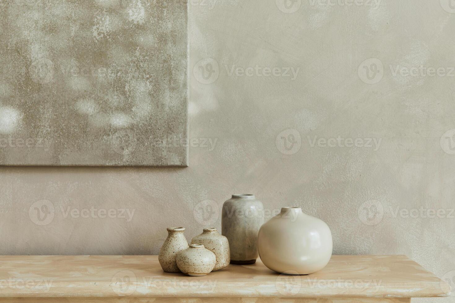 Stylish minimalistic monochromatic composition with design vases and accessories. Poster on the wall, copy space. Neutral colors. Template. photo