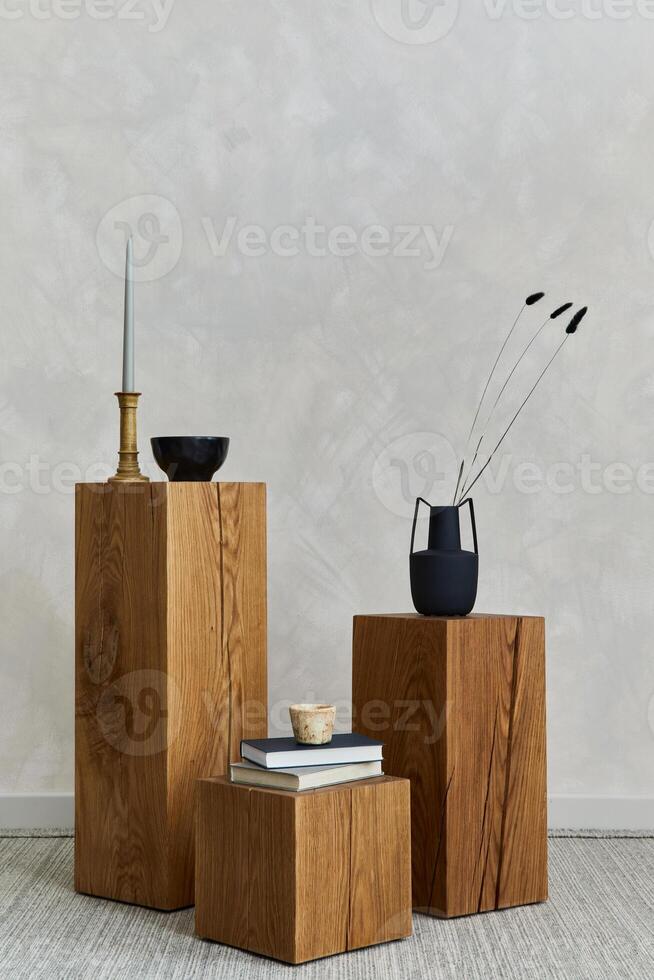 Creative composition of stylish spacious living room with wooden cubes, lamp, design vase and small personal accesories. Japandi style. Details. Copy space. Template. photo