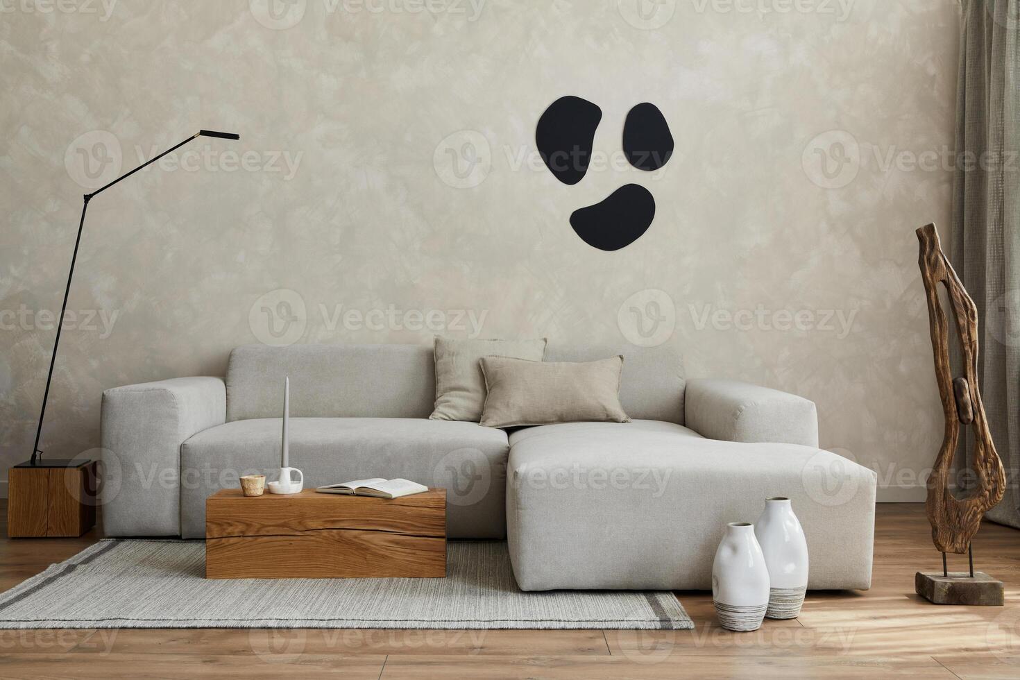 Creative composition of stylish living room with grey sofa, wooden cubes and small personal accesories. Creative wall and parquet floor. Copy space. Template. photo