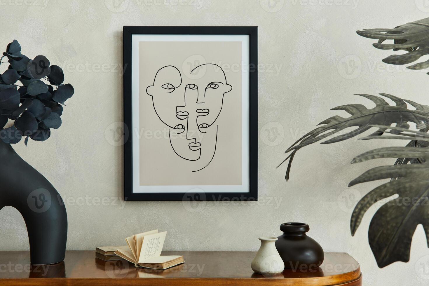 Stylish composition of creative living room interior with mock up poster frame, wooden commode, palm leaves, black dry leaves in designed vase and elegant personal accessories. Template. photo