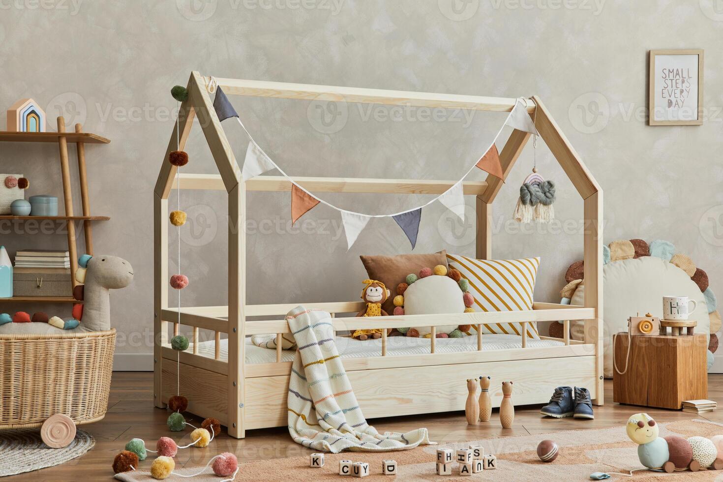 Stylish composition of cozy scandinavian child's room interior with wooden bed, shelf, plush and wooden toys and textile hanging decorations. Neutral creative wall, carpet on the floor. Template. photo