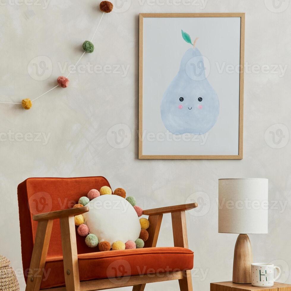 Creative composition of cozy scandinavian child's room interior with mock up poster frame, red armchair, plush toys and hanging decorations. Neutral creative wall and the parquet floor. Template. photo