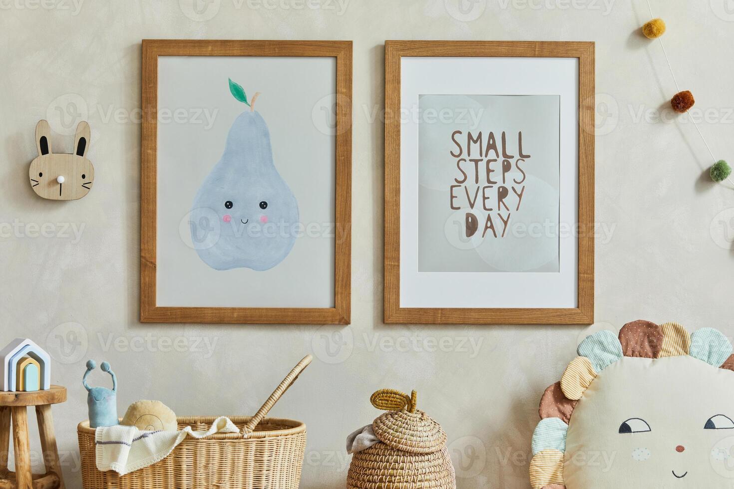Stylish composition of cozy scandi child's room interior with two mock up poster frames, rattan basket, toys and textile decorations. Creative wall. Copy space. Template. photo