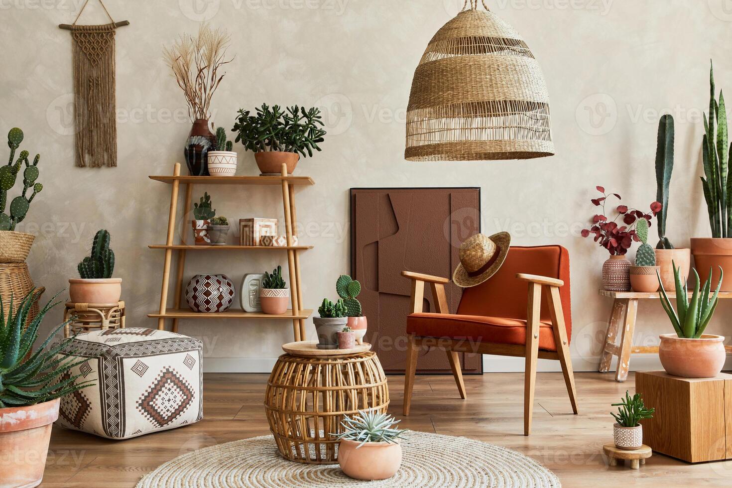 Stylish composition of modern living room interior with structure painting, a lot of cacti and plants, armchair, wooden shelves and accessories. Creative wall, carpet on the floor. Template. photo