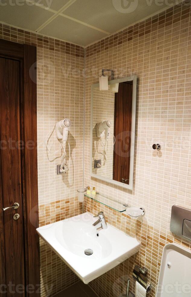 Interior of bathroom with sink basin,Modern bathroom in luxury house,Modern wash basin in the bathroom photo