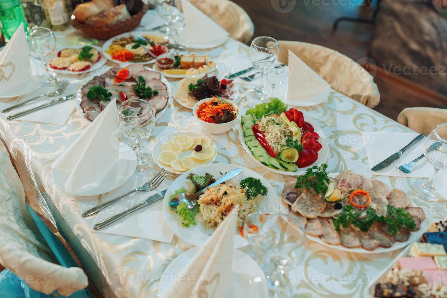 A table with a variety of food and drinks, including a salad, a sandwich photo