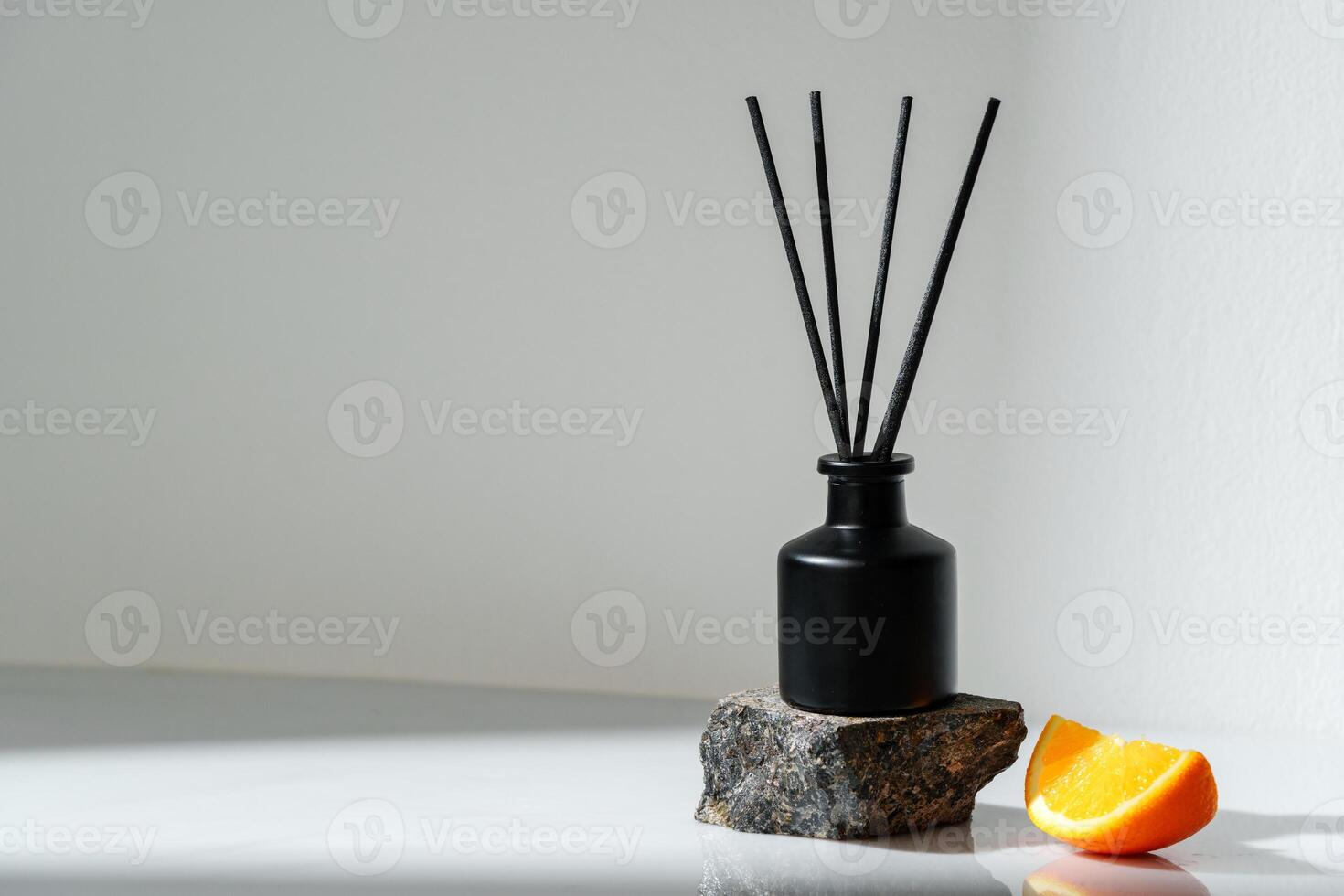 Aromatic Reed Diffuser on a Stone Base With Orange Slice Accent photo