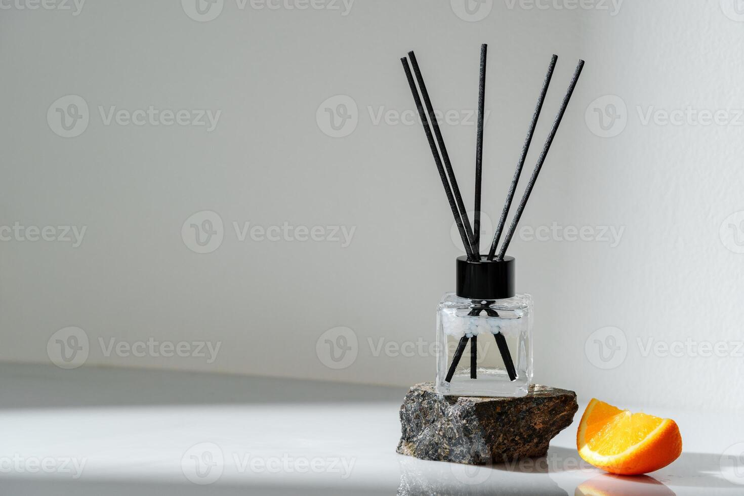 Aromatic Reed Diffuser on a Stone Base With Orange Slice Accent photo