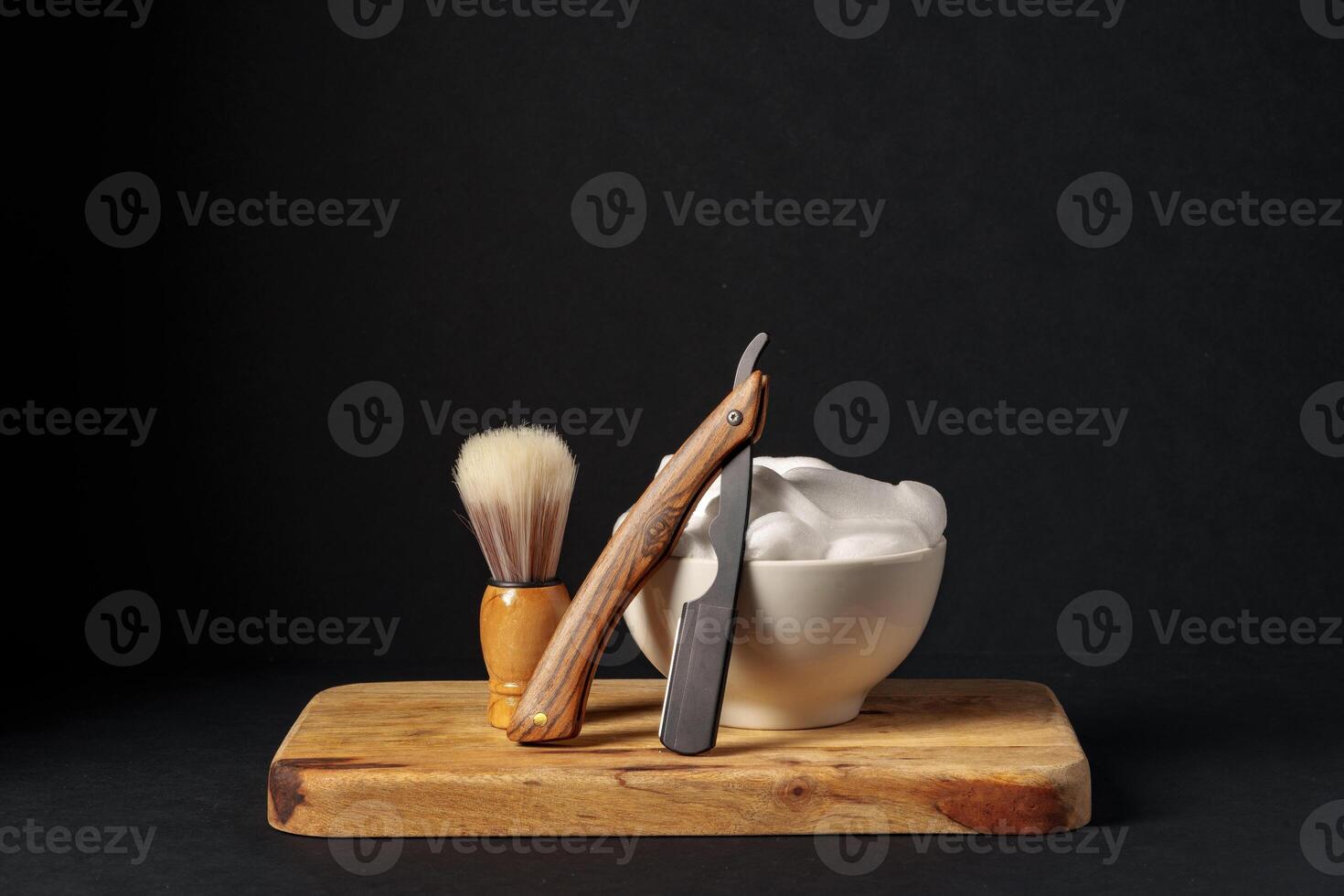 Classic Shaving Equipment With Razor, Brush, and Soap on Wooden Stand Against Dark Background photo