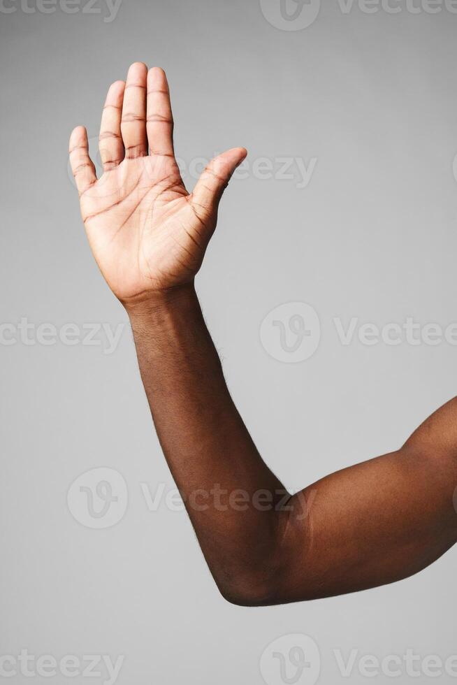 African Man Arm Raised in the Air photo