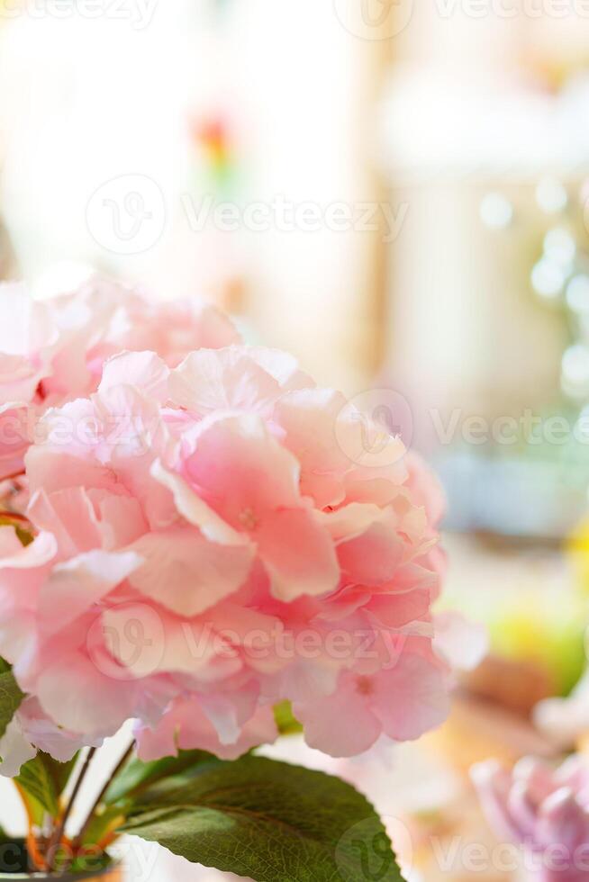 Pink Flowers in Vase on Table photo