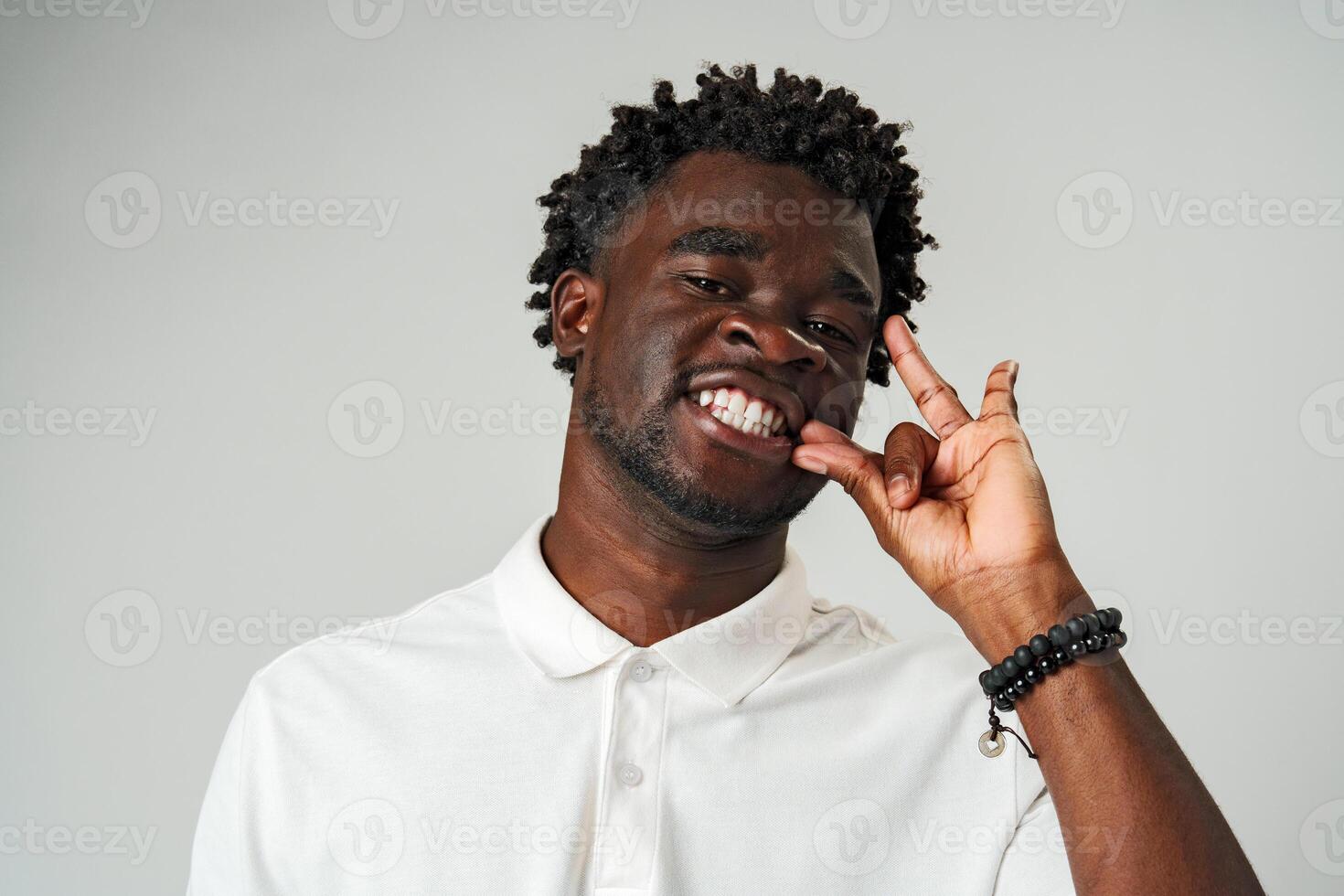 African Man Making a Hush Gesture With Finger photo