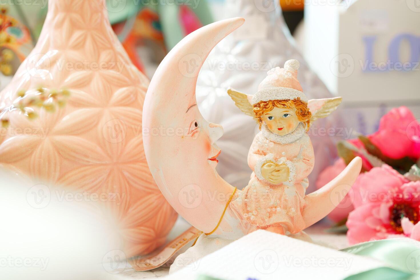 Little Girl Figurine Sitting on the Moon photo