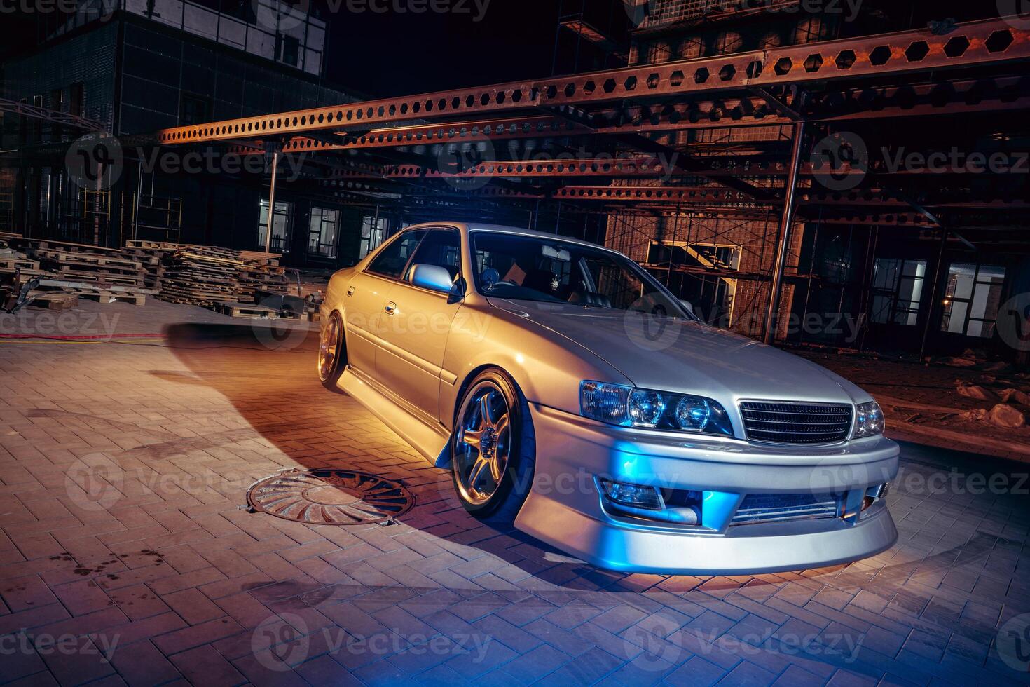 Silver Car Parked in Front of Building photo