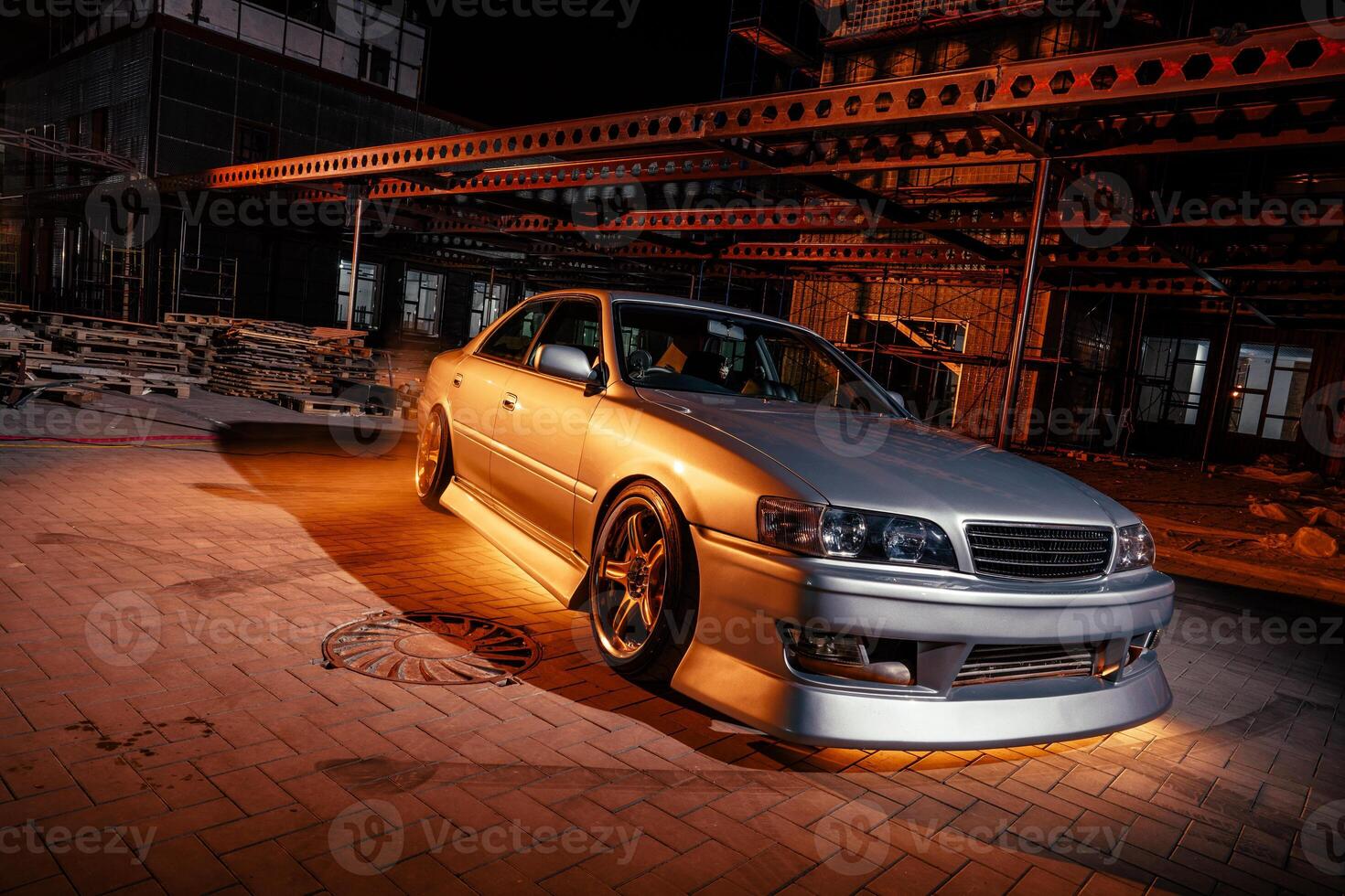 Silver Car Parked in Front of Building photo