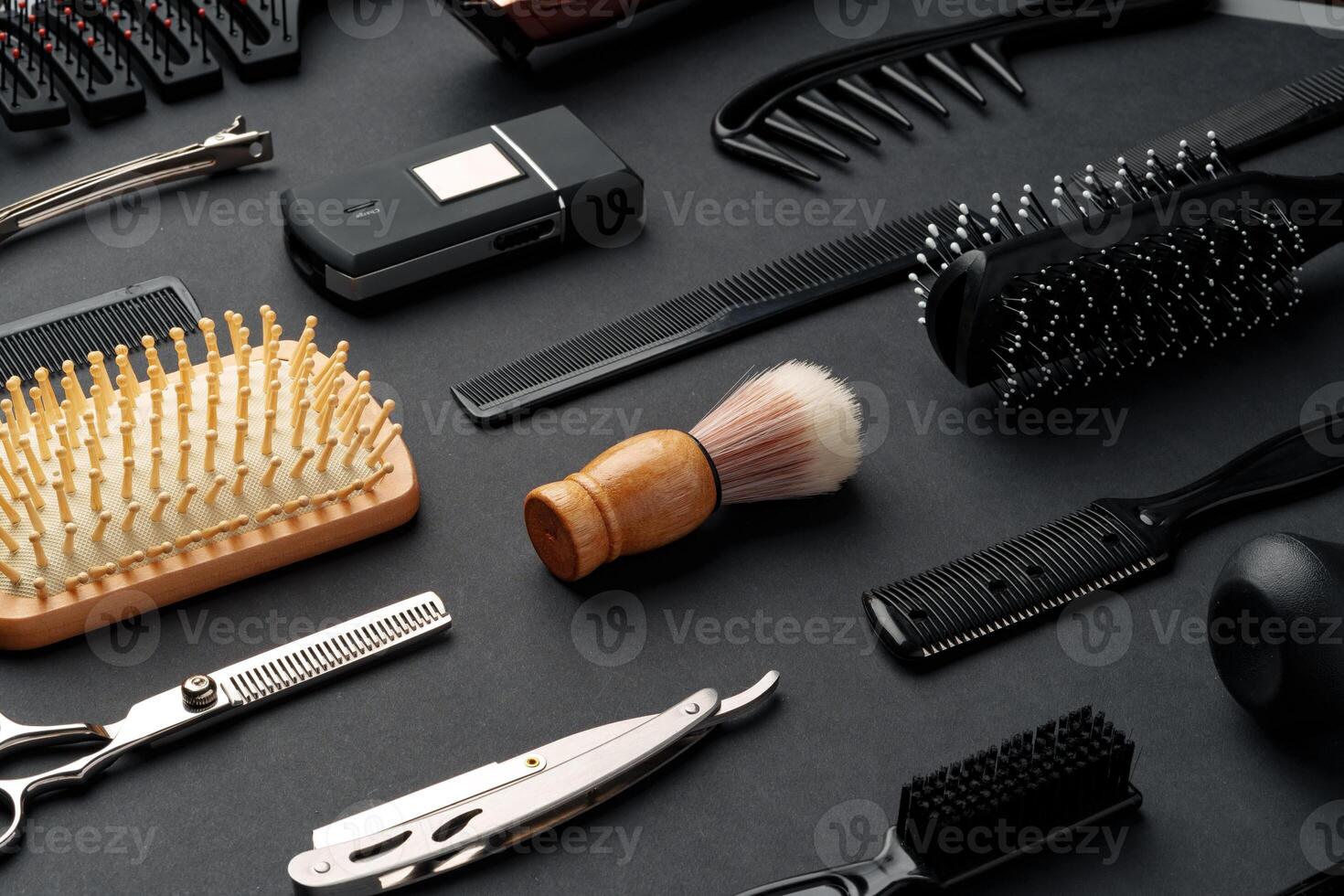 Variety of Hair Styling Tools and Accessories Displayed on a Dark Background photo