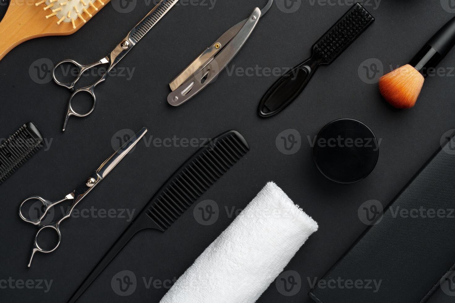 Variety of Hair Styling Tools and Accessories Displayed on a Dark Background photo