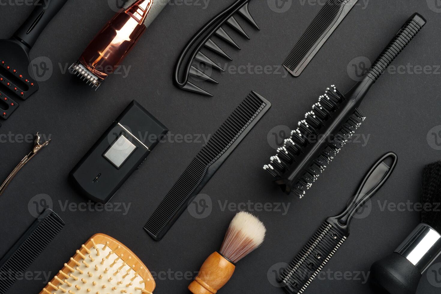 Variety of Hair Styling Tools and Accessories Displayed on a Dark Background photo