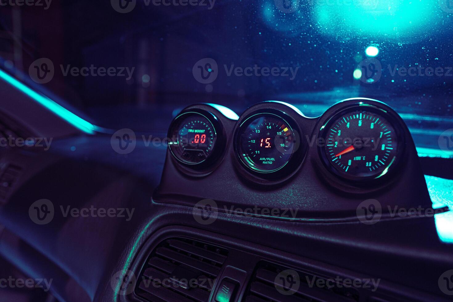 Car Dashboard With Three Gauges and Speedometer photo
