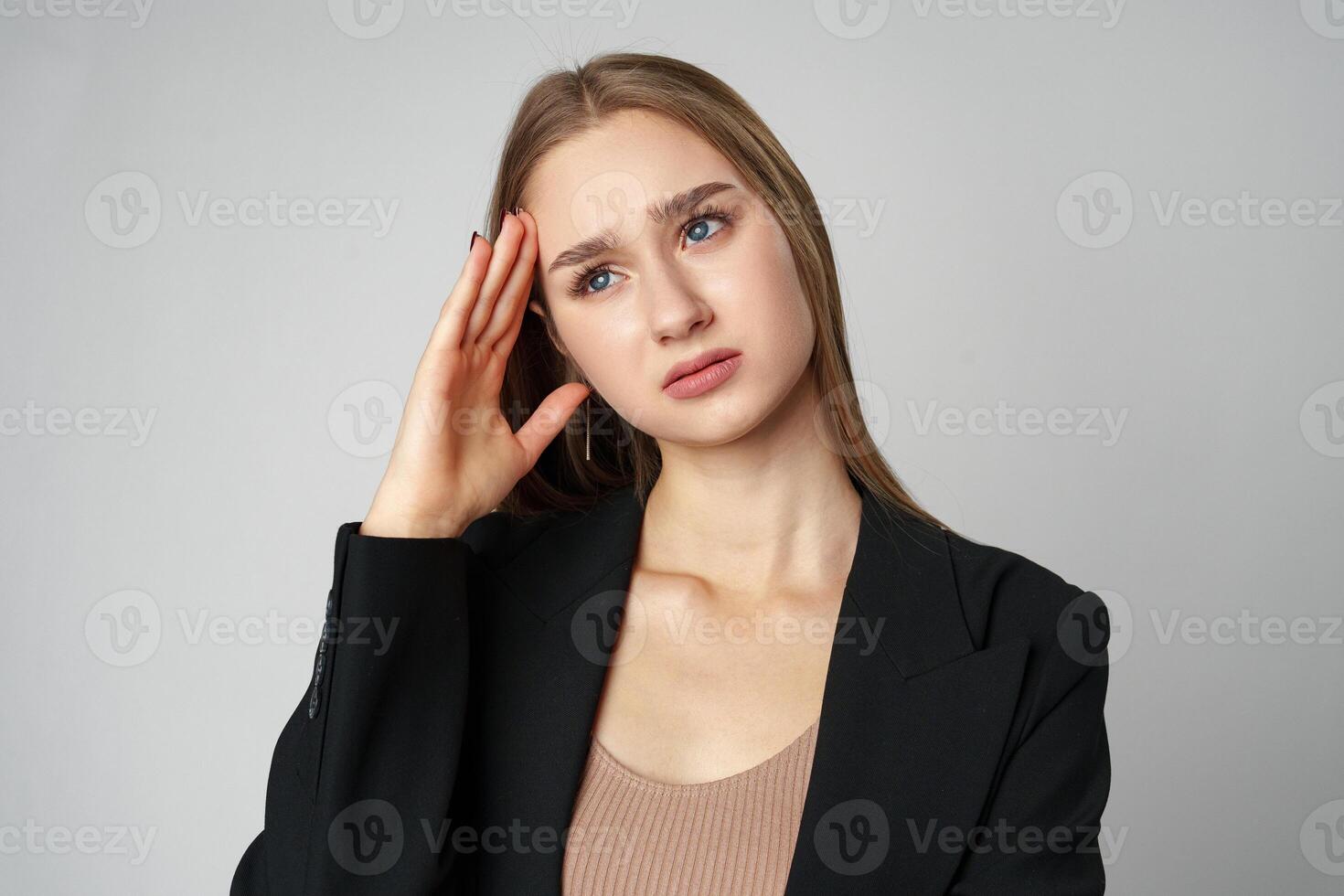 Woman Posing With Hands on Face against gray background photo
