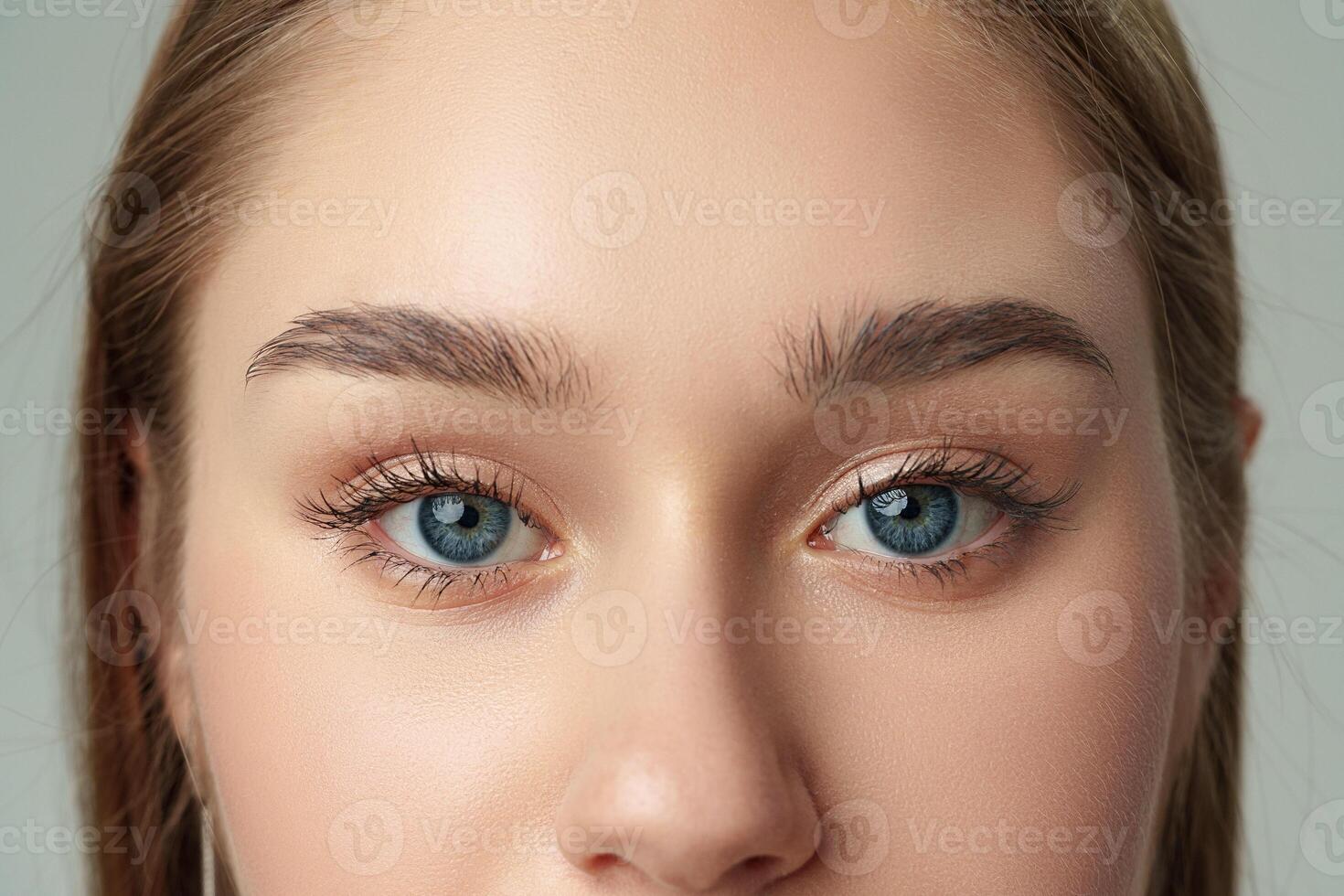Close Up of Womans Face With Blue Eyes photo