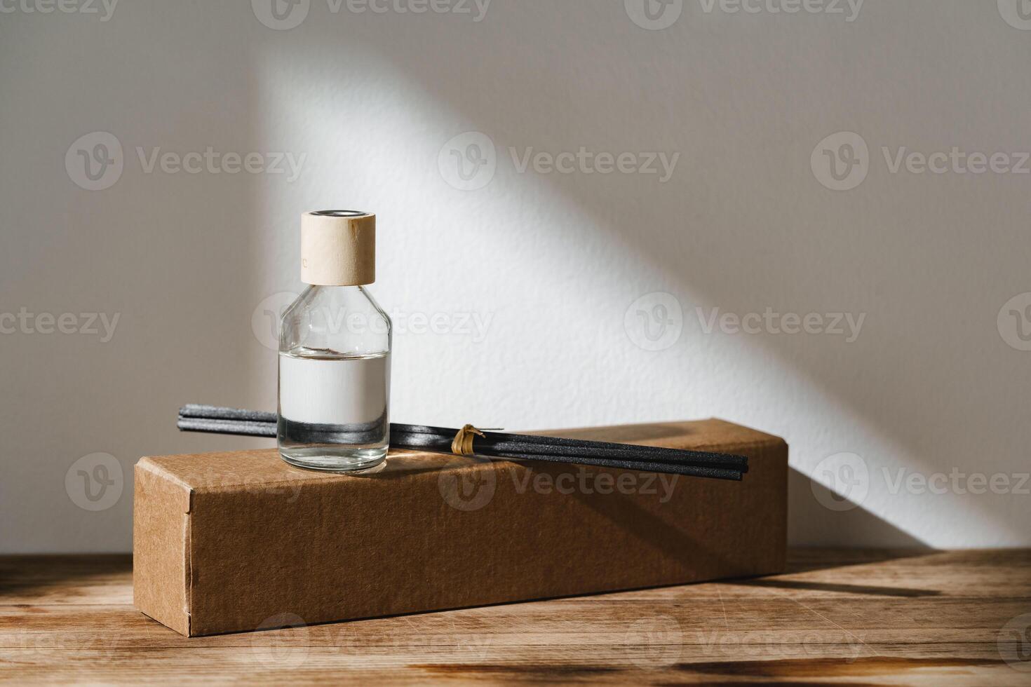 Elegant Reed Diffuser With Shadows on Wooden Surface in Soft Morning Light photo