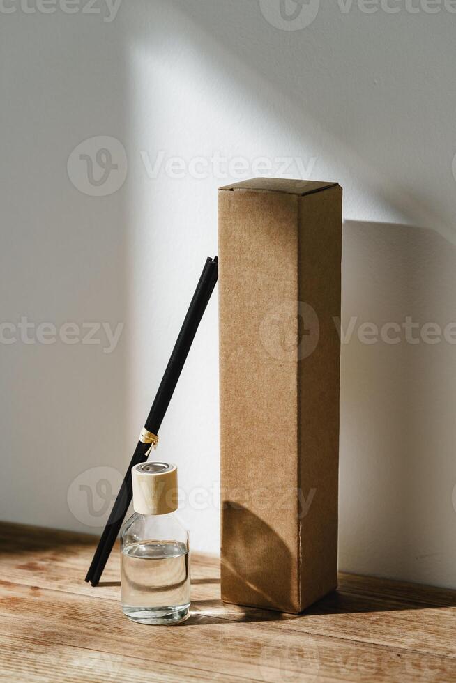 Elegant Reed Diffuser With Shadows on Wooden Surface in Soft Morning Light photo