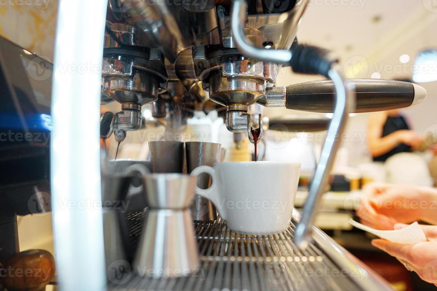Preparing Espresso in a Modern Cafe During Busy Morning Hours photo