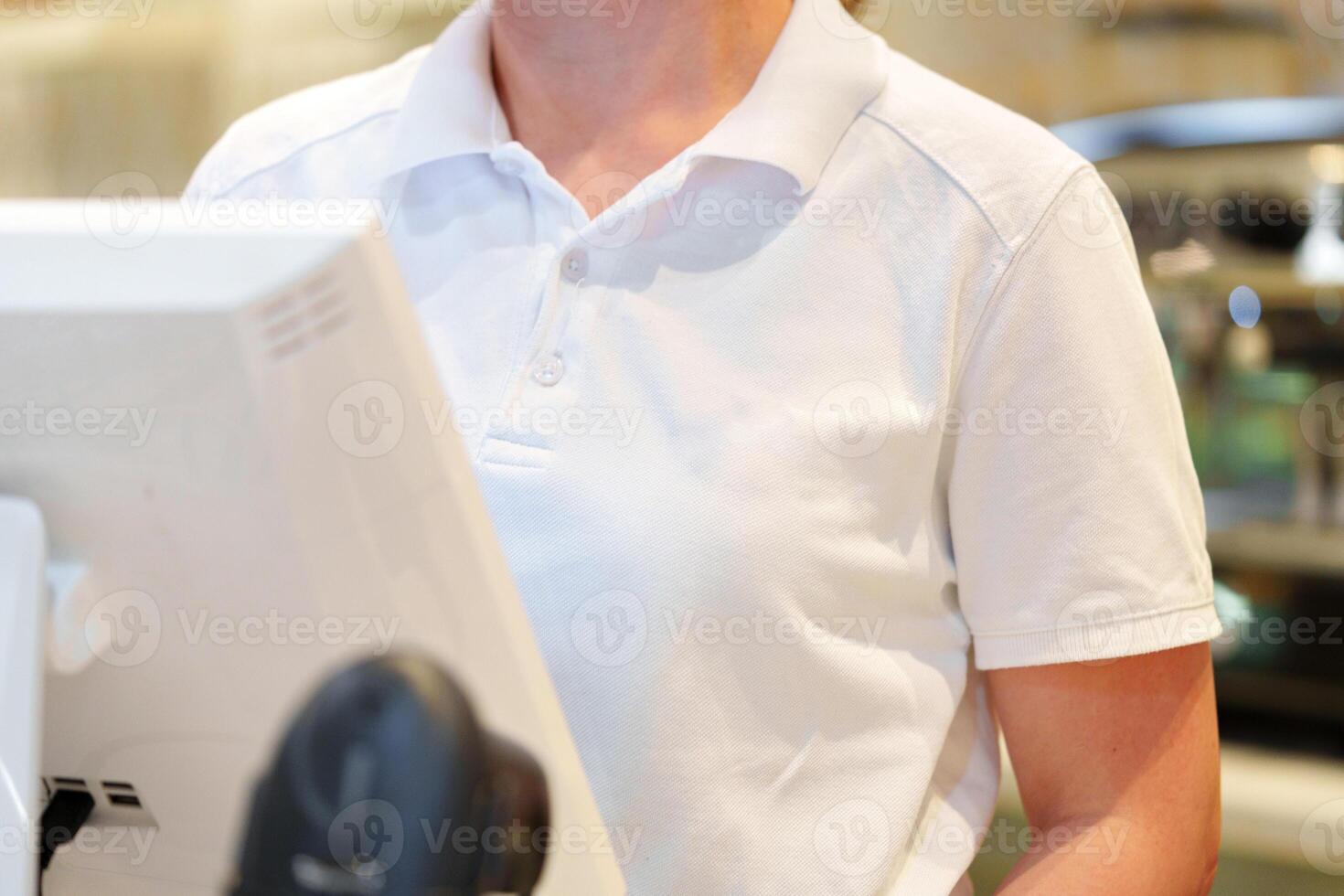 Woman Standing in Front of Computer Monitor photo