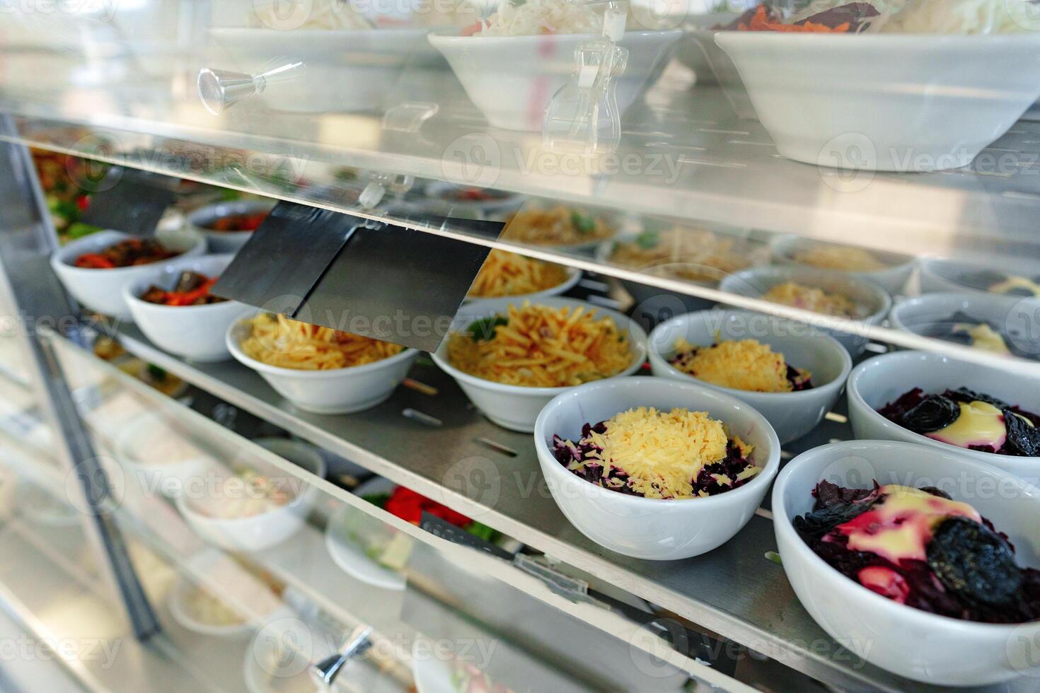 Bustling Cafeteria Serving Line During Lunchtime Offering a Variety of Dishes photo