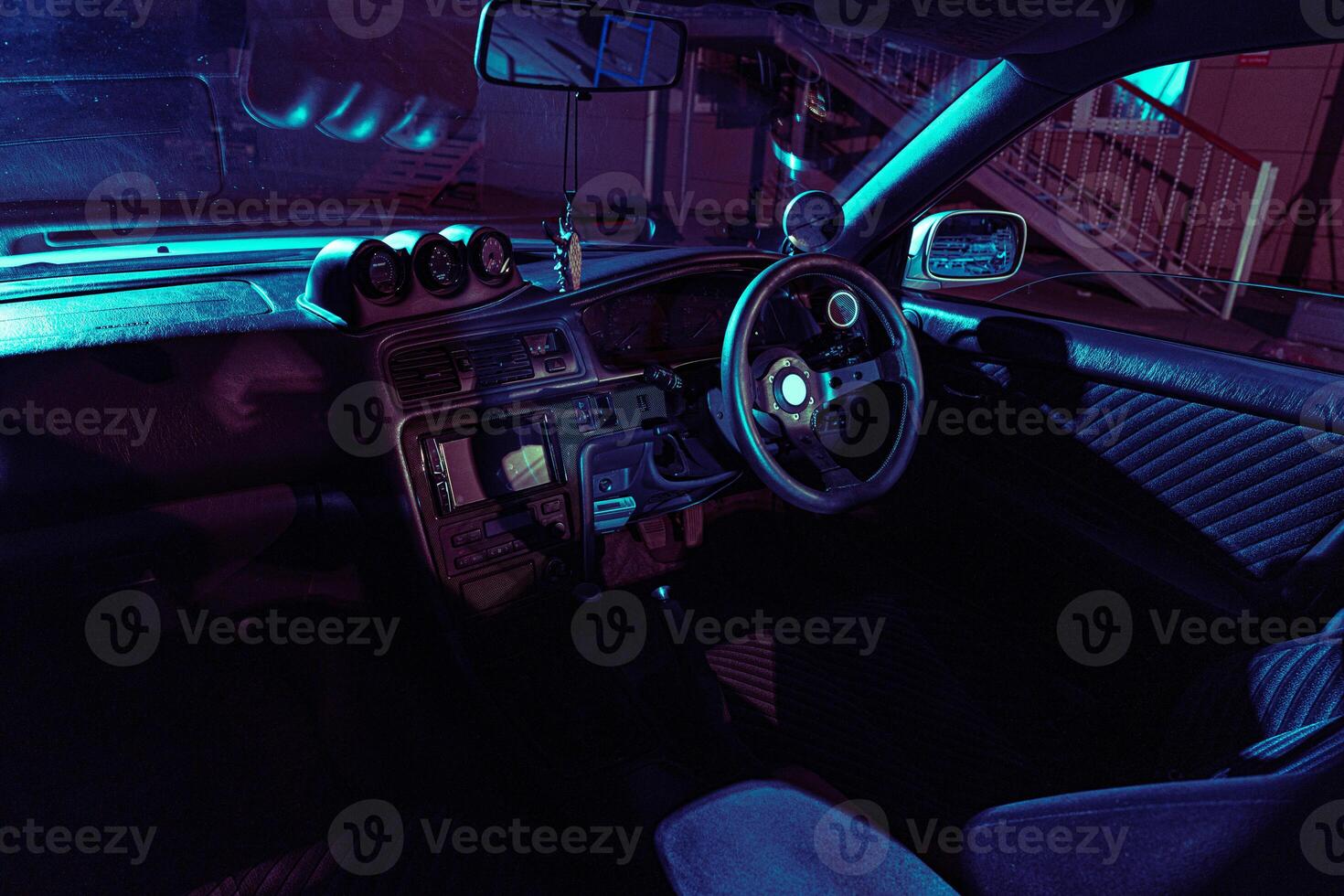 The Interior of a Car With Blue Lights photo