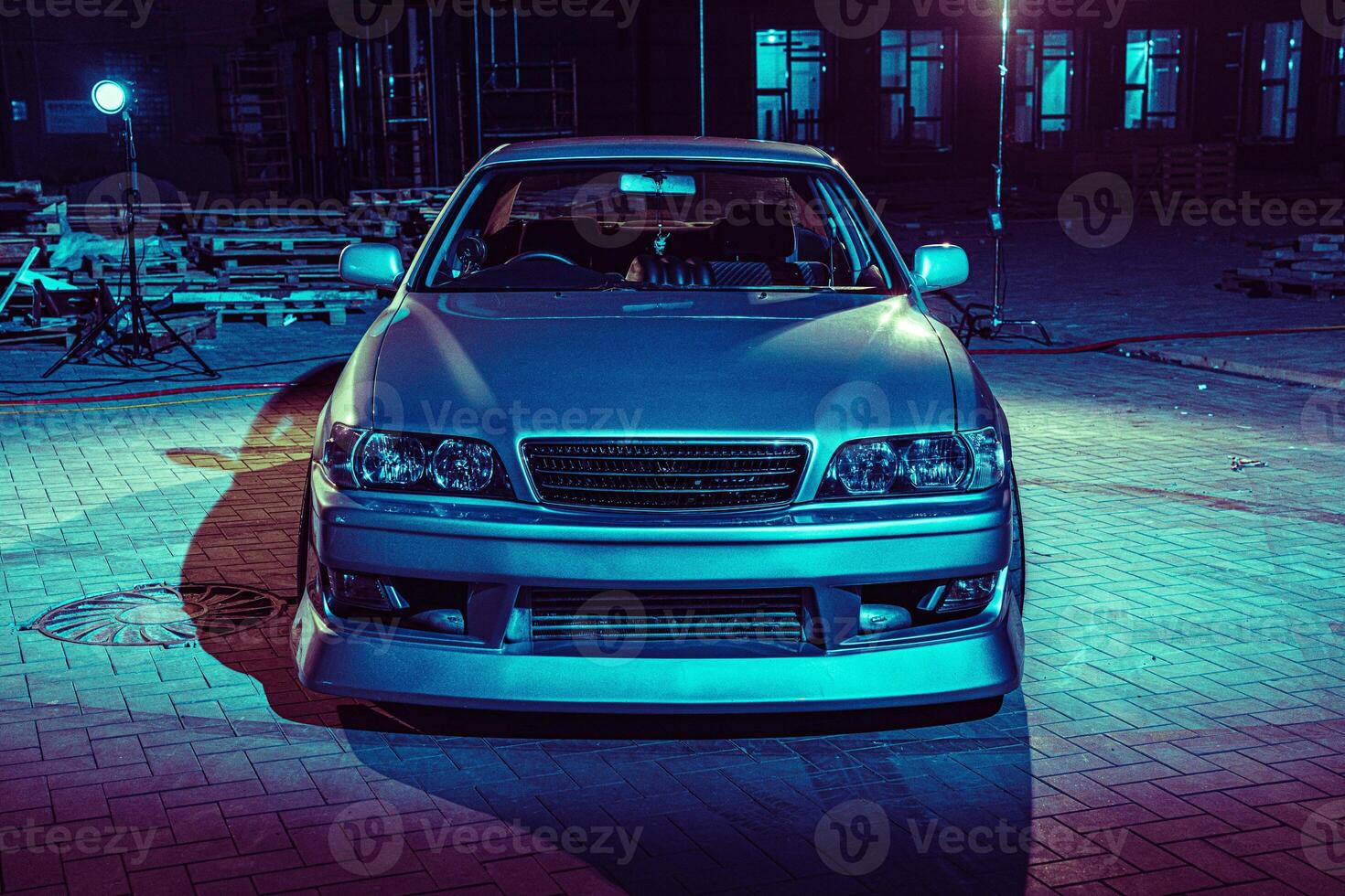 Silver Car Parked in Front of Building photo