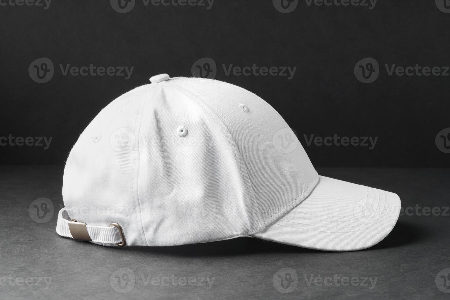 White Baseball Cap on Black Background photo