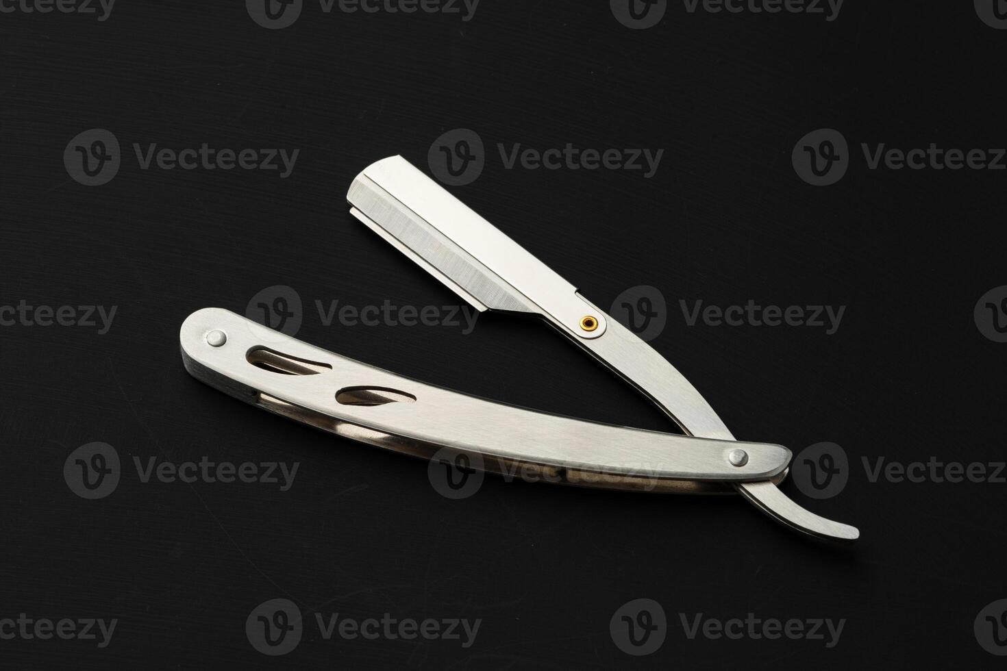 Barber shaving blade on black background close up photo