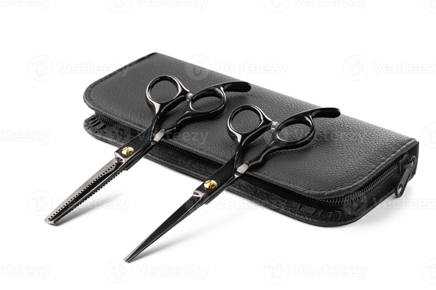 Hairdressing scissors with leather case on white background photo