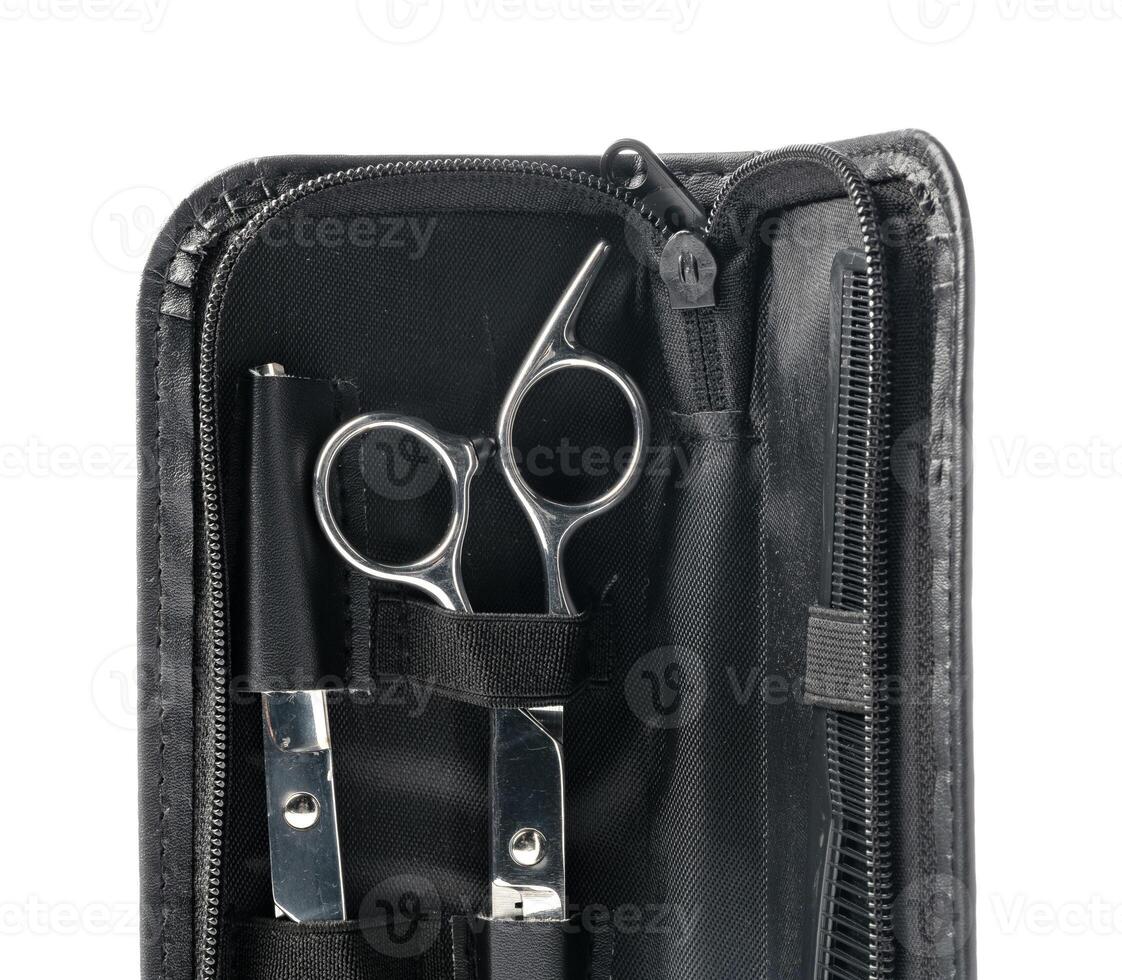 Hairdressing scissors with leather case on white background photo