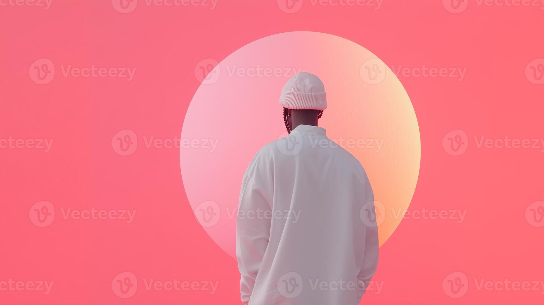 A person gazing at a large pastel sun against a vibrant pink background during sunset in an artistic setting photo