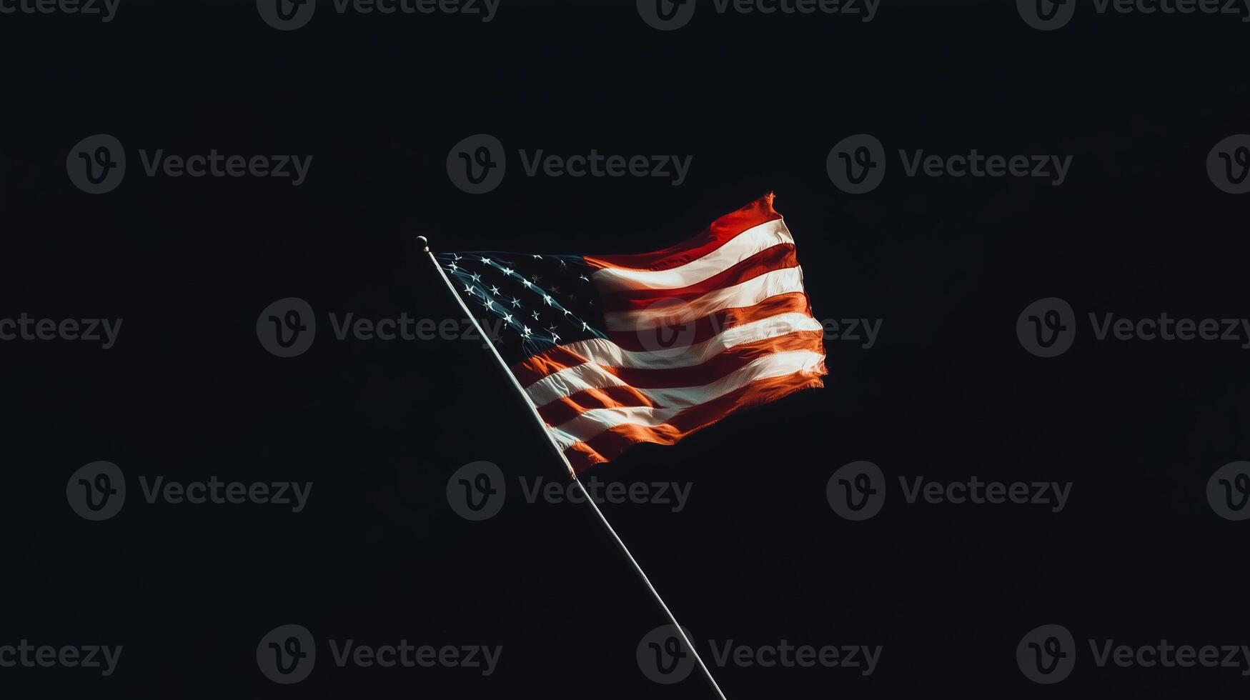American flag waving against a dark sky at night, symbolizing patriotism and freedom in a serene moment photo