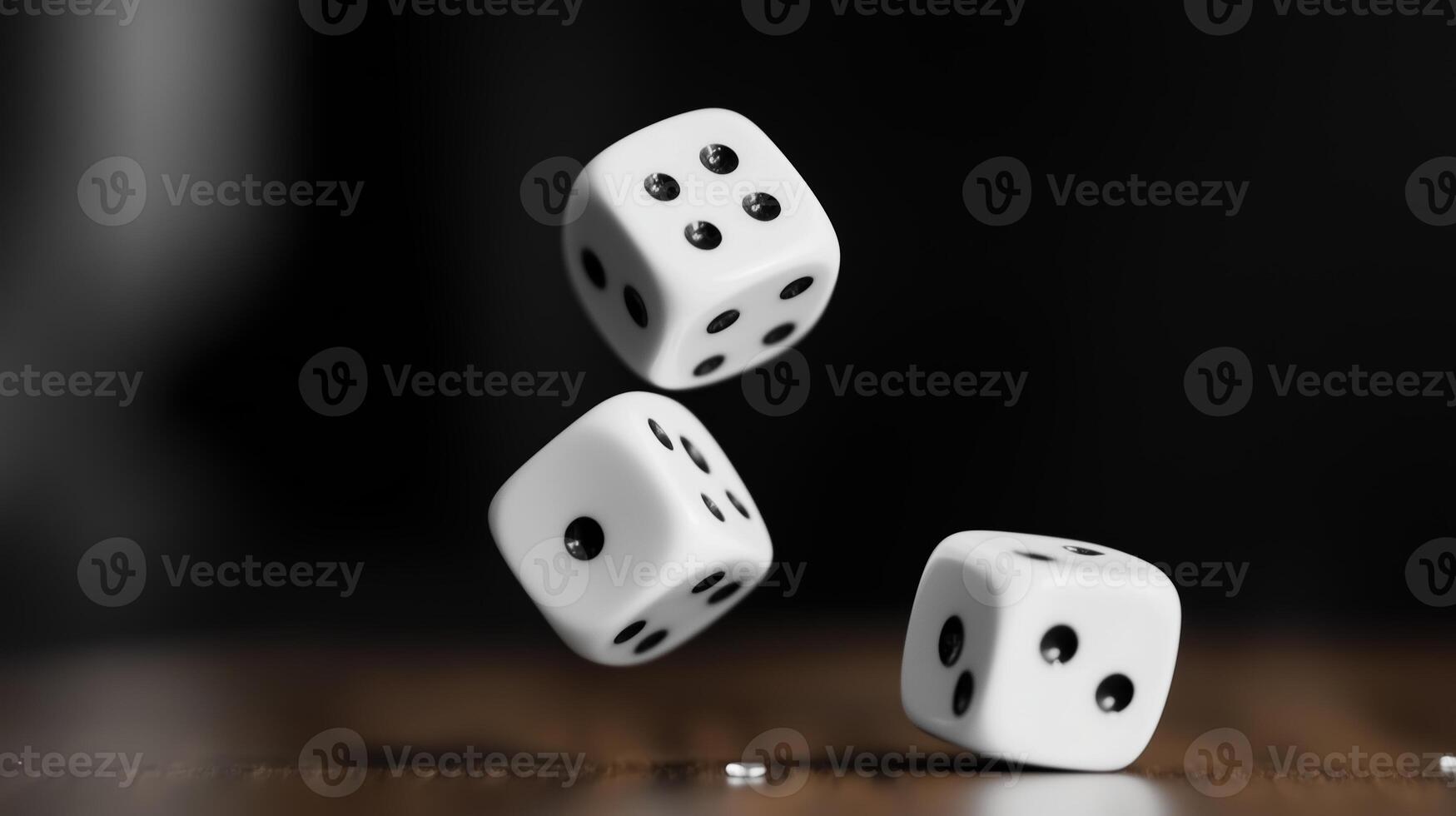 Three white dice rolling through the air above a wooden surface, captured in motion during a lively gaming session photo