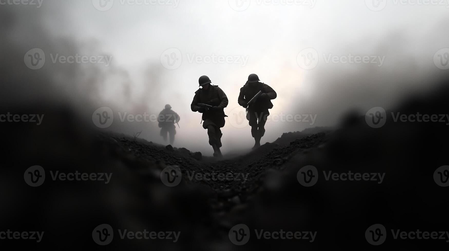 Soldiers advance through a foggy terrain during a military exercise at dawn, demonstrating teamwork and resilience photo