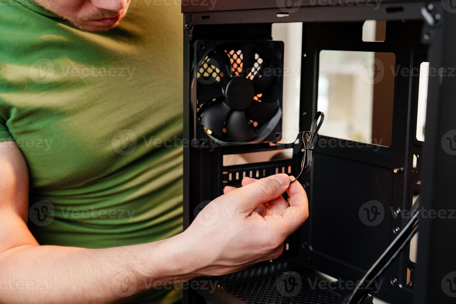 Close up of man repairing computer system unit photo